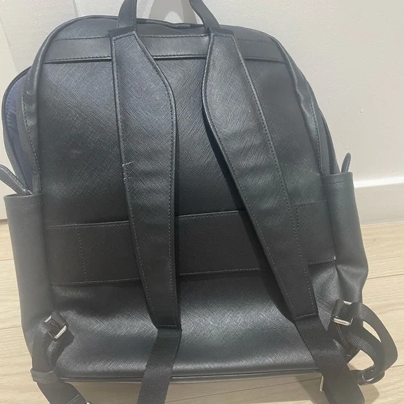 Tumi backpack in black leather